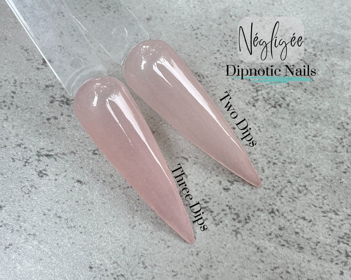 Photo shows swatch of Dipnotic Nails Négligée Sheer Nude Pink Nail Dip Powder The Sheer Nude Collection
