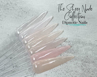 Photo shows swatch of Dipnotic Nails Négligée Sheer Nude Pink Nail Dip Powder The Sheer Nude Collection