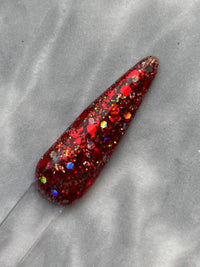 Photo shows swatch of Dipnotic Nails Peppermint Twist Red Christmas Nail Dip Powder