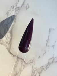 Photo shows swatch of Dipnotic Nails Perspective Effect Blackened Purple Nail Dip Powder Mountain Mood Collection
