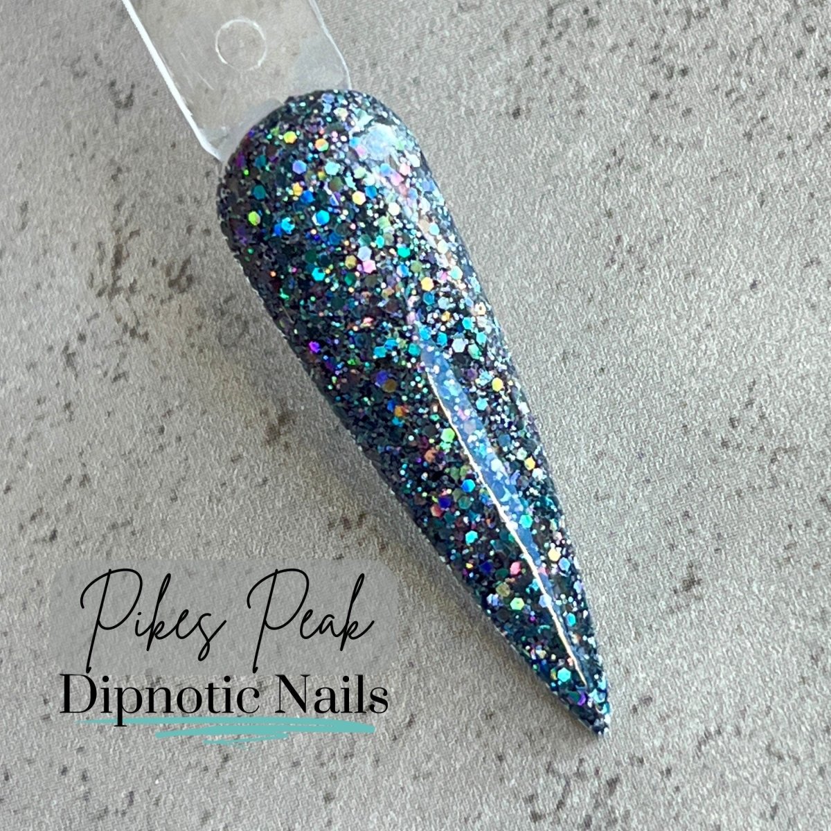 Photo shows swatch of Dipnotic Nails Pikes Peak Holographic Gunmetal Silver Dip Powder The Colorado Winter Collection