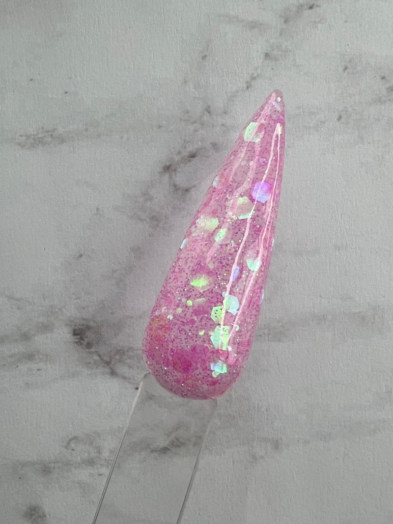 Photo shows swatch of Dipnotic Nails Pink Drink Neon Glitter Nail Dip Powder
