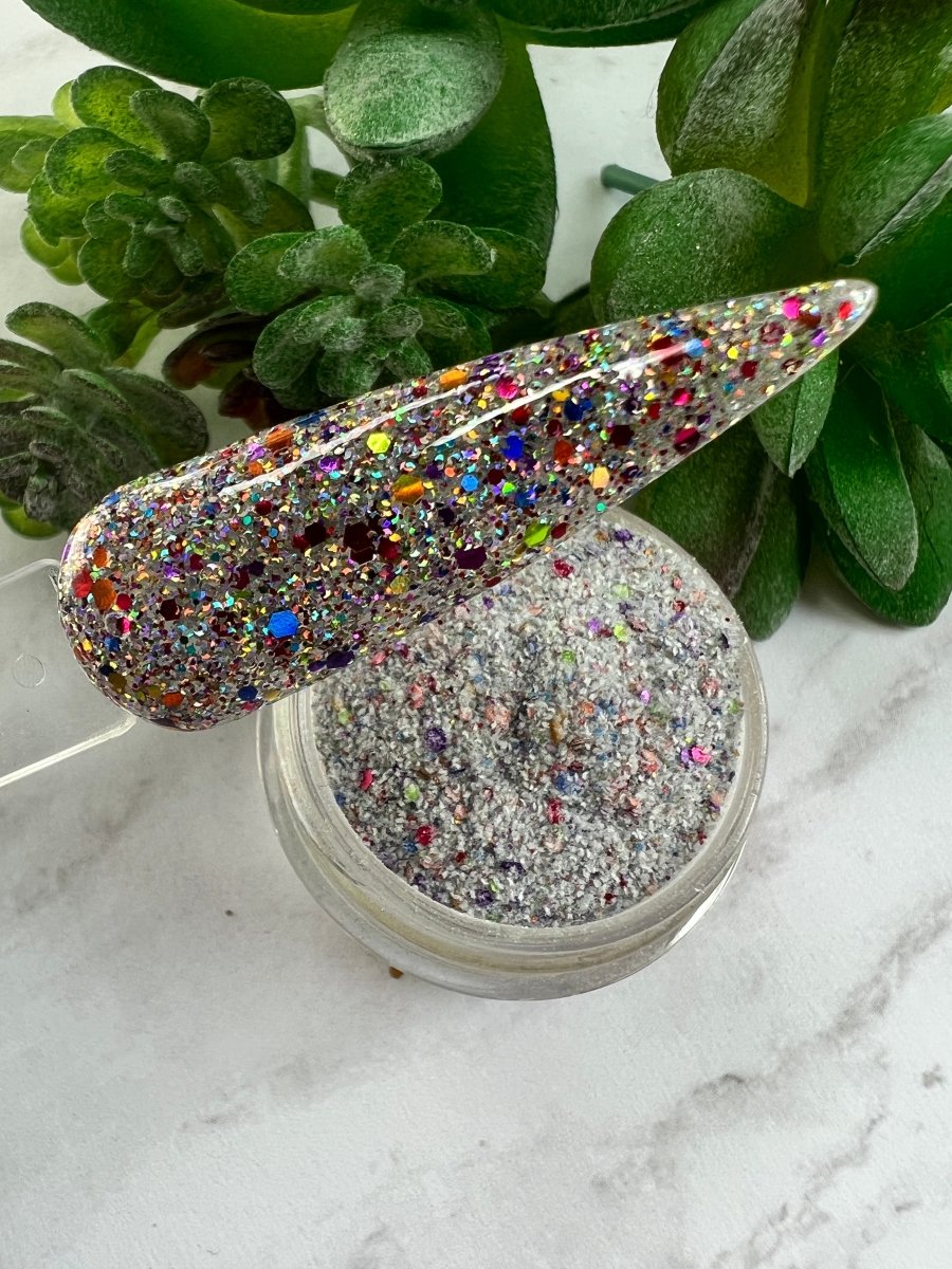 Photo shows swatch of Dipnotic Nails Pride Parade Rainbow Pride Glitter Nail Dip Powder