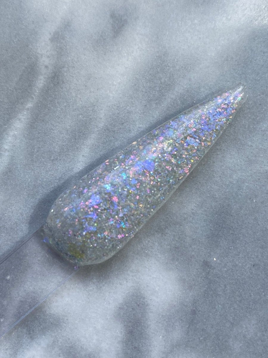 Photo shows swatch of Dipnotic Nails Prism Opal White Shimmer Nail Dip Powder
