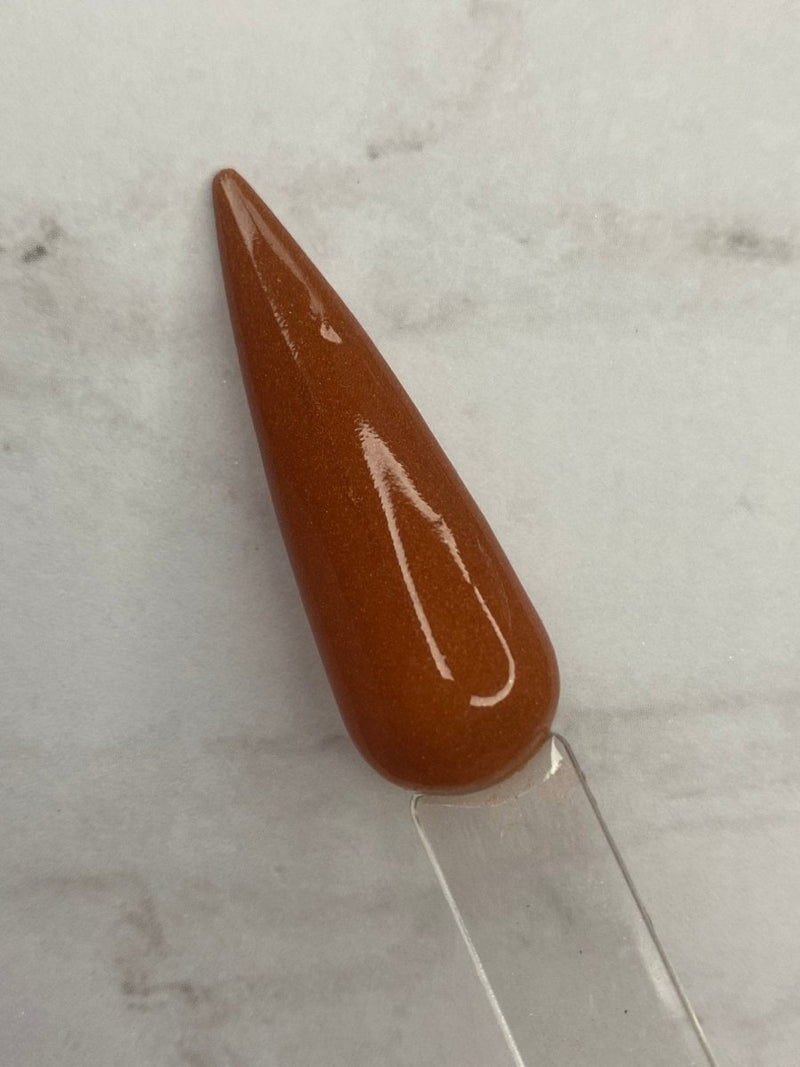Photo shows swatch of Dipnotic Nails Pumpkin Patch Solid Orange Nail Dip Powder