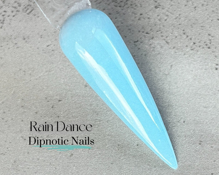 Photo shows swatch of Dipnotic Nails Rain Dance Light Blue Nail Dip Powder The April Showers and May Flowers Collection