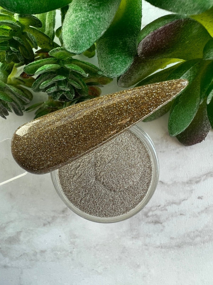 Photo shows swatch of Dipnotic Nails Reflect Gold Reflective Glitter Nail Dip Powder