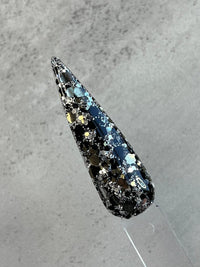 Photo shows swatch of Dipnotic Nails Rocky Mountains Black, Silver, and Gold Glitter Dip Powder The Colorado Winter Collection