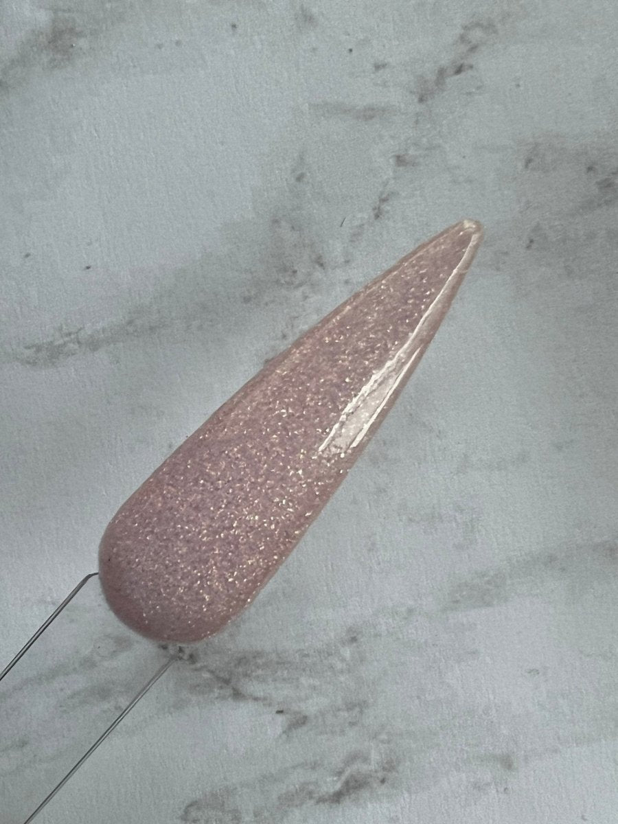 Photo shows swatch of Dipnotic Nails Rose Quartz Pink Nail Dip Powder