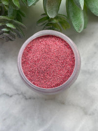 Photo shows swatch of Dipnotic Nails Ruby July Birthstone Red Nail Dip Powder