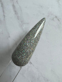 Photo shows swatch of Dipnotic Nails Shalom Silver Holographic Nail Dip Powder The Hello Holo Collection
