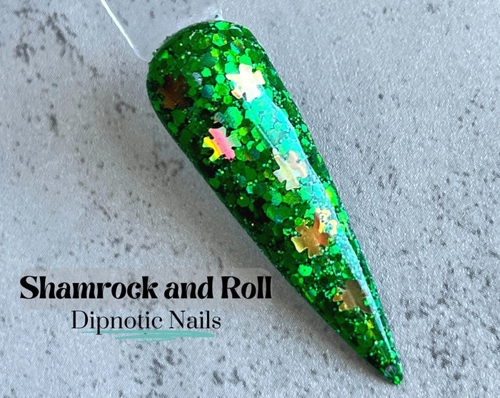 Photo shows swatch of Dipnotic Nails Shamrock and Roll Green and Gold Clover Nail Dip Powder The Irish for a Day Collection