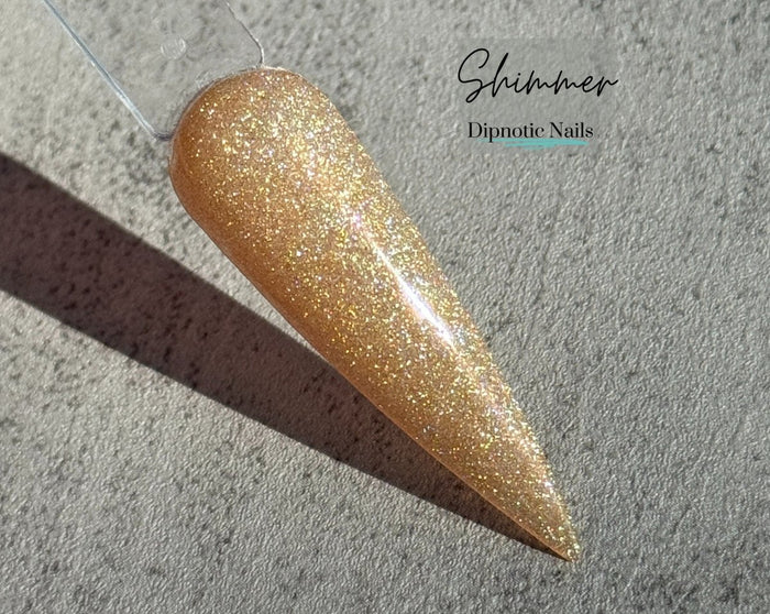 Photo shows swatch of Dipnotic Nails Shimmer Yellow Chameleon Nail Dip Powder The Butterfly Effect Collection