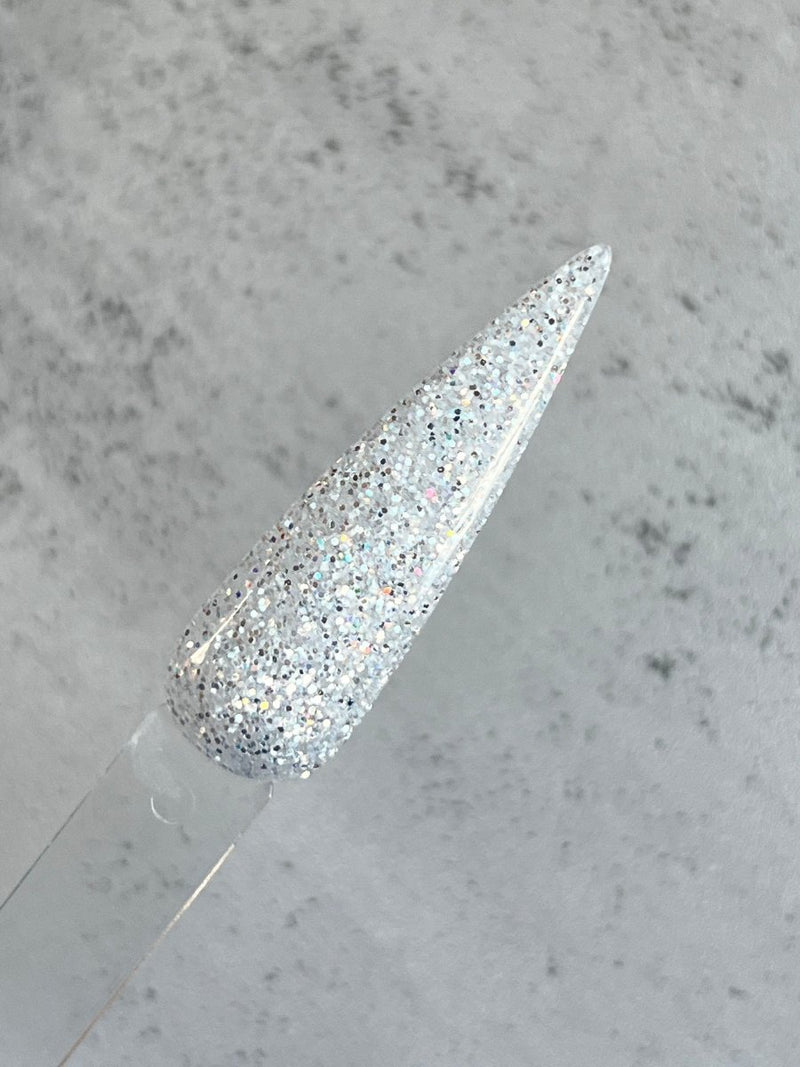 Photo shows swatch of Dipnotic Nails Snow Drift White Silver Mirror Glitter Dip Powder The Colorado Winter Collection