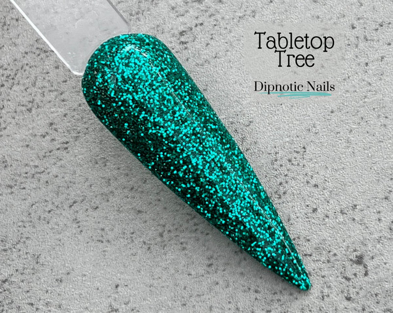 Photo shows swatch of Dipnotic Nails Tabletop Tree Teal Nail Dip Powder The Vintage Christmas Collection