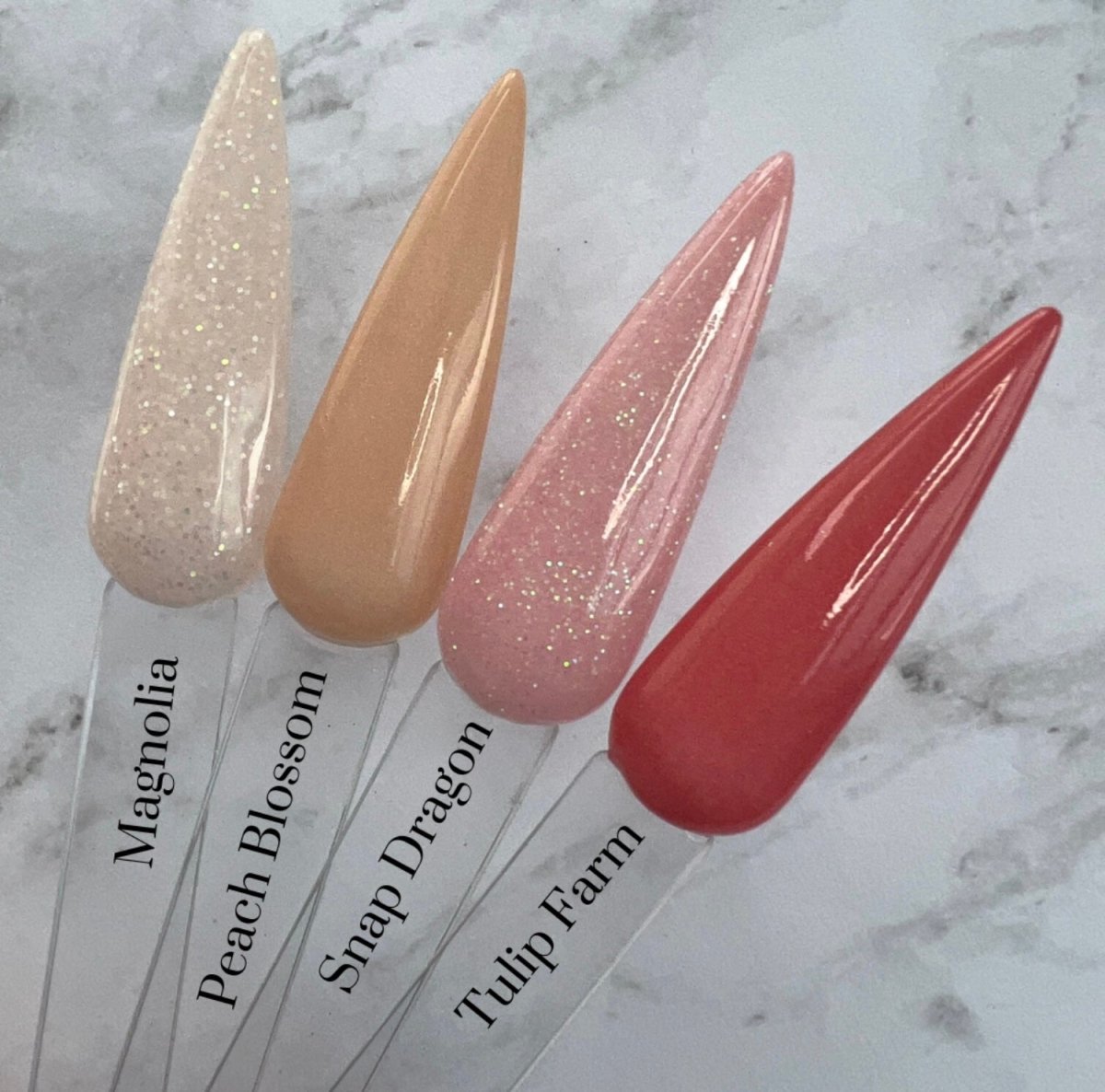Photo shows swatch of Dipnotic Nails The Garden Collection Pinks Nail Dip Powder Collection