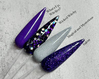 Photo shows swatch of Dipnotic Nails The Wicked Witchy Collection Purple, Black, and Silver Dip Powder Collection