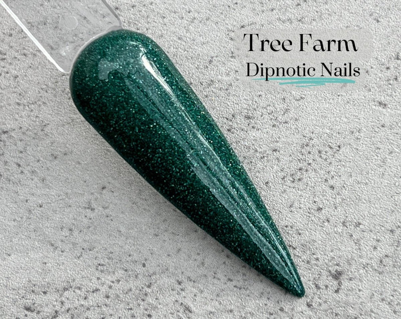 Photo shows swatch of Dipnotic Nails Tree Farm Green Christmas Nail Dip Powder Christmas 2023 Collection