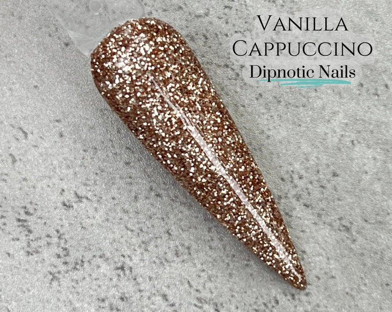 Photo shows swatch of Dipnotic Nails Vanilla Cappuccino Warm Gold Brown Nail Dip Powder Coffee Bar Dip Powder Collection