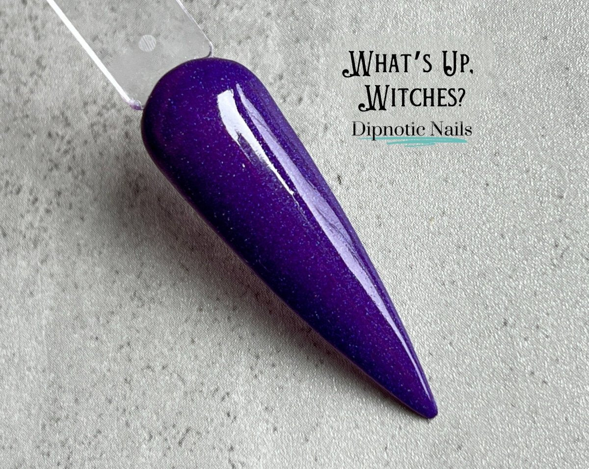 Photo shows swatch of Dipnotic Nails What's Up, Witches? Dark Purple Nail Dip Powder The Wicked Witchy Collection
