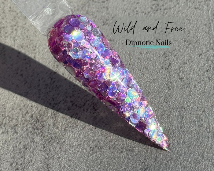 Photo shows swatch of Dipnotic Nails Wild and Free Pastel Purple Holographic Nail Dip Powder The Butterfly Effect Collection