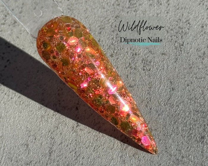 Photo shows swatch of Dipnotic Nails Wildflower Orange Nail Dip Powder The Butterfly Effect Collection