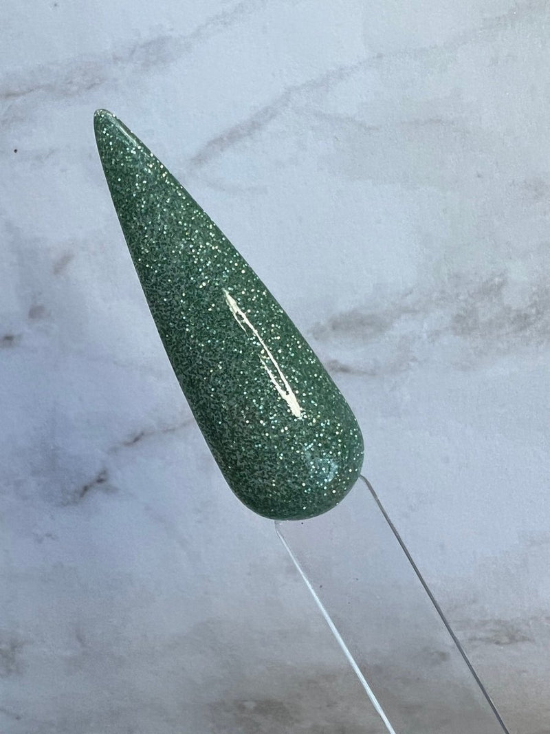 Photo shows swatch of Dipnotic Nails Willow Green Nail Dip Powder