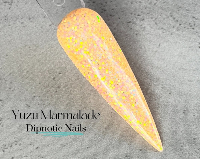 Photo shows swatch of Dipnotic Nails Yuzu Marmalade Orange and Yellow Color Shift Nail Dip Powder The Citrus Sunrise Collection